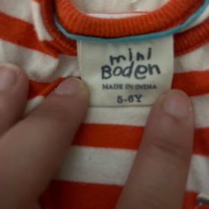 Red and White striped muscle tank. Has front pocket